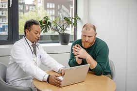 Person talking to medical doctor about penis health