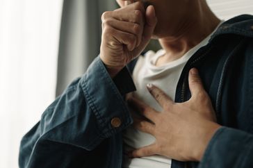 man coughing