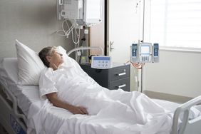 female patient in hospital looking out window