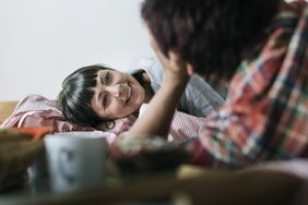 Couple waking up in bed
