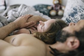 Couple sleeping together in bed