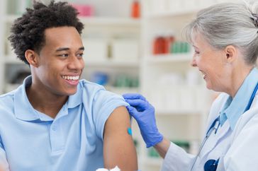 Young man receives flu vaccine