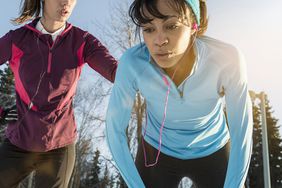 Runners out of breath and taking a break
