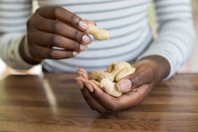 someone holding peanuts