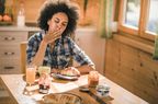 Woman eating breakfast