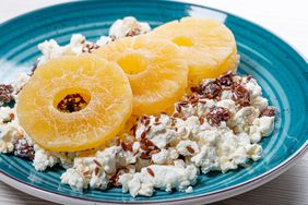 Close up of cottage cheese with flax seeds and dried pineapple rings
