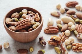mixed nuts in wooden bowl, keto snacks