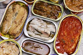 A group of opened tinned fish on a table