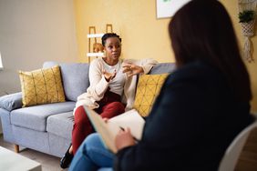 Woman sharing thoughts to therapist during therapy session