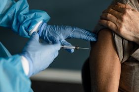 older woman receiving vaccine