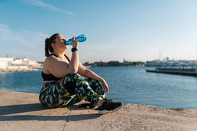 woman drinking sports drink