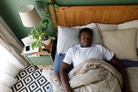 Man sleeping on his back.