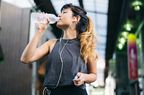 Young Japanese woman jogging outdoor in summer