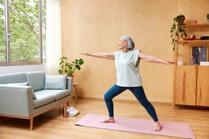 Mature person practicing yoga.