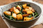 Bowl with a home made meal of braised turnips with sauteed greens