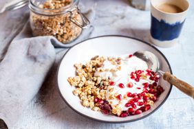 Homemade granola with buckwheat and amaranth puffs, pomegranate seeds, and greek yogurt