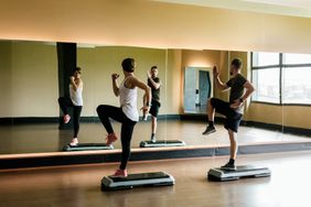 Couple practicing step indoors