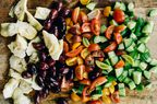 Chopped Mediterranean Vegetables on a wooden cutting board.