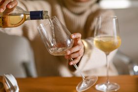 Pouring a glass of white wine