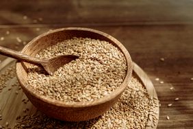 a wooden bowl with flaxseeds