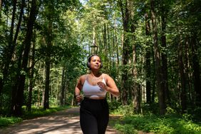 woman running in the forest