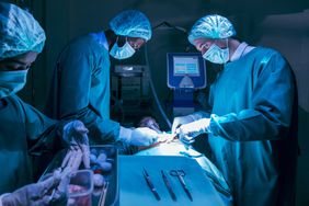 heart surgeons completing a heart transplant