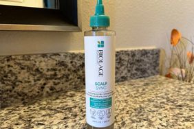 Biolage Scalp Sync Purifying Scalp Concentrate placed on floor