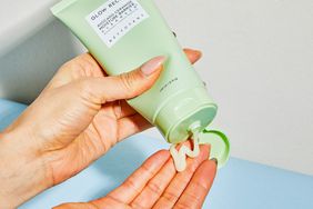 Glow Recipe Avocado Ceramide Moisture Barrier Cleanser on a person's finger tips 