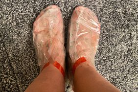 A person's feet in the PLANTIFIQUE Peach Foot Peeling Mask socks