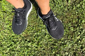 A person wearing Hoka Gaviota 5 running shoes outdoors