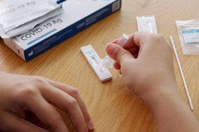 person taking at home covid test