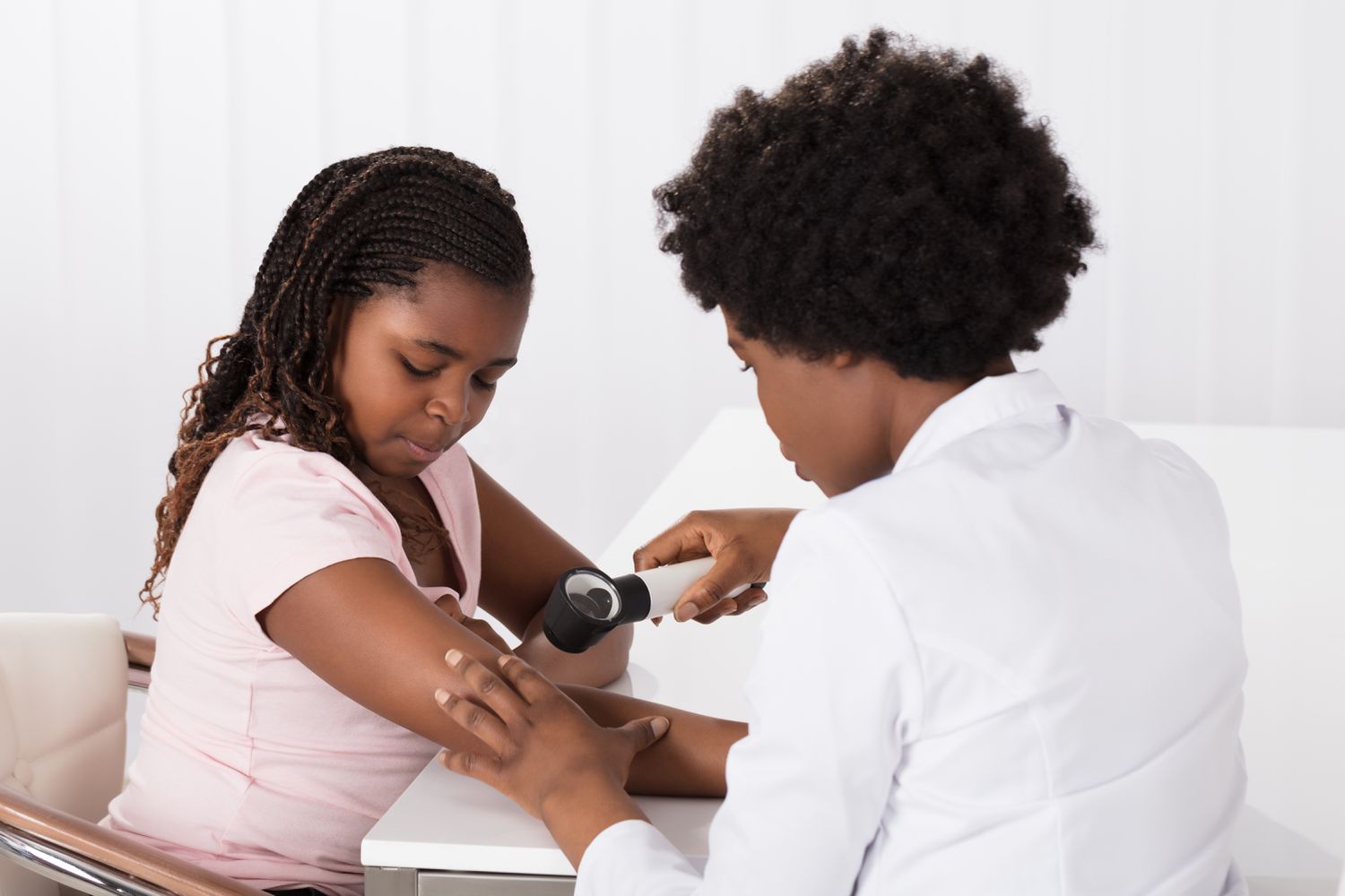 dermatologist examining hs on skin