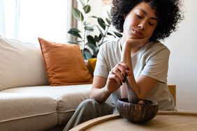 young woman with hypothyroidism feeling tired and having no appetite 