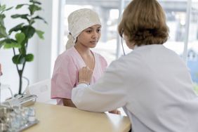 young girl with leukemia symptoms seeing doctor 