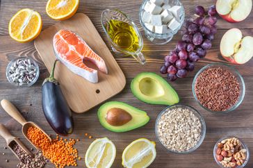 Foods providing low cholesterol diet on the wooden background