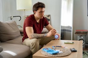 Man with diabetes takes a finger blood test 
