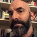 A headshot of Mark Gurarie in front of a bookshelf.