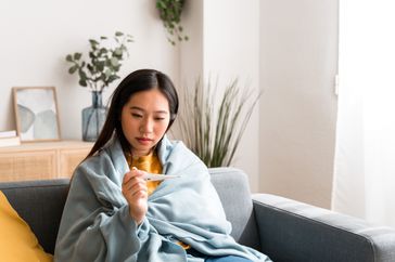 woman with meningitis having a fever and chills 