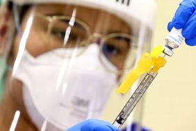 LOS ANGELES, CALIFORNIA - AUGUST 10: Licensed Vocational Nurse (LVN) Gabriela Solis prepares a dose of the Jynneos monkeypox vaccine at an L.A. County vaccination site in East Los Angeles on August 10, 2022 in Los Angeles, California. Los Angeles County reported 683 monkeypox cases as of August 9th, double the amount of cases from ten days earlier. California Governor Gavin Newsom declared a state of emergency on August 1st over the monkeypox outbreak which continues to grow globally. (Photo by Mario Tama/Getty Images)