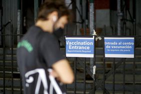 A man waits in line to recieve the Monkeypox vaccine before the opening of a new mass vaccination site at the Bushwick Education Campus in Brooklyn on July 17, 2022, in New York City. - New York, on the US East Coast, has already either administered or scheduled 21,500 vaccines and hopes to speed up the process, promising more than 30,000 jabs for the whole state. (Photo by Kena Betancur / AFP) (Photo by KENA BETANCUR/AFP via Getty Images)