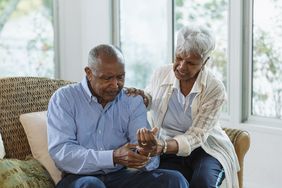 older person experiencing muscle weakness in the hands