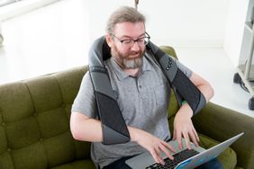 Person wearing Resteck Neck and Back Massager