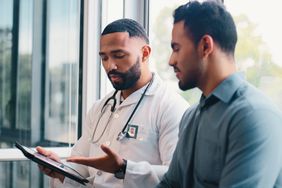 Doctor going over results with patient.
