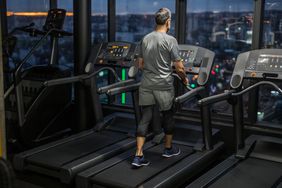 man working out in gym during eveninghours
