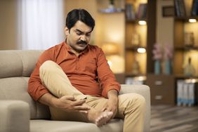 person with plantar fasciitis foot pain