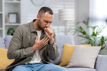 person with popcorn lung coughing
