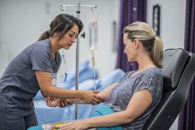 doctor giving IV treatment for pulmonary embolism