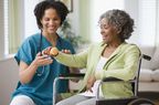older woman getting physical therapy treatment for rheumatoid arthritis