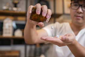 person taking vitamins for restless legs syndrome