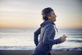 woman running near water